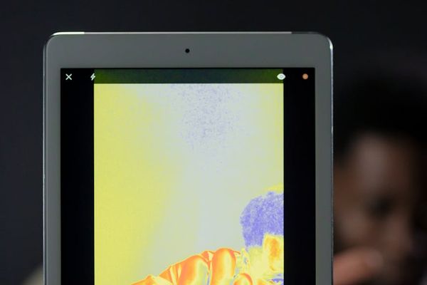 Energy audit specialist with thermal imaging camera