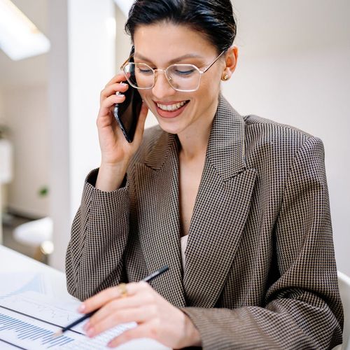 Woman in professional business suit with warm smile